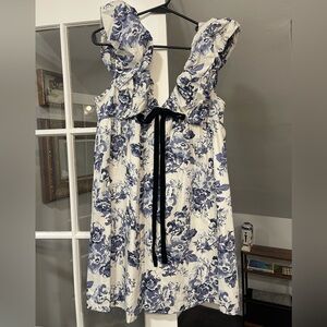 Blue floral babydoll mini dress with black bow